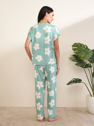 Women's mint green floral print pajama set, viewed from the back.