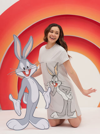 Women posing in a light gray nightgown with a Bugs Bunny print and a large Bugs Bunny cutout.