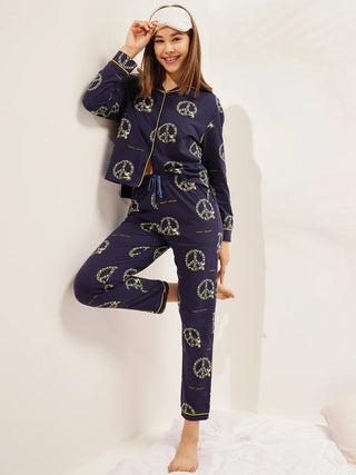 a women wearing a navy snoopy front open pyjama set made of 100% cotton