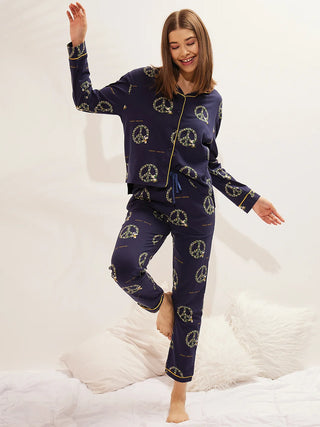 a women wearing navy snoopy front open pyjama set made of 100% cotton