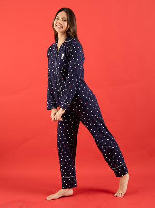 a girl wearing navy full sleeve front open pyjama set 