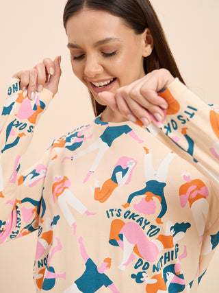 a woman wearing peach long sleeve pyjama set
