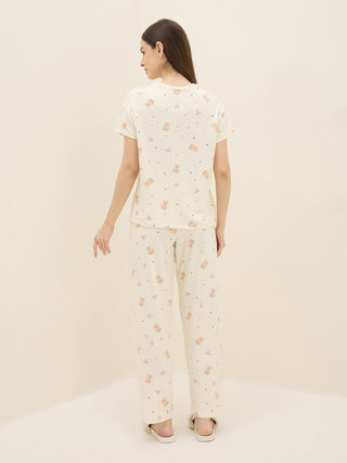 Women's ivory teddy bear print short-sleeve pajama set, posing from the back.