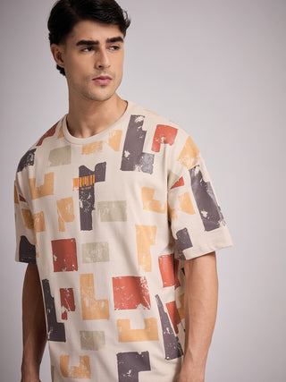 Men's beige short-sleeve t-shirt with a distressed abstract geometric print, featuring a subtle barcode graphic.