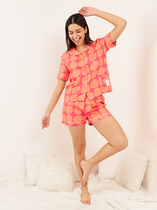 a woman wearing magenta cotton short set and standing in beautiful pose