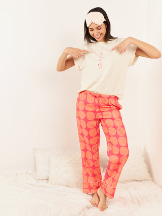 a girl smiling and standing wearing vanilla half sleeve t shirt pyjama 